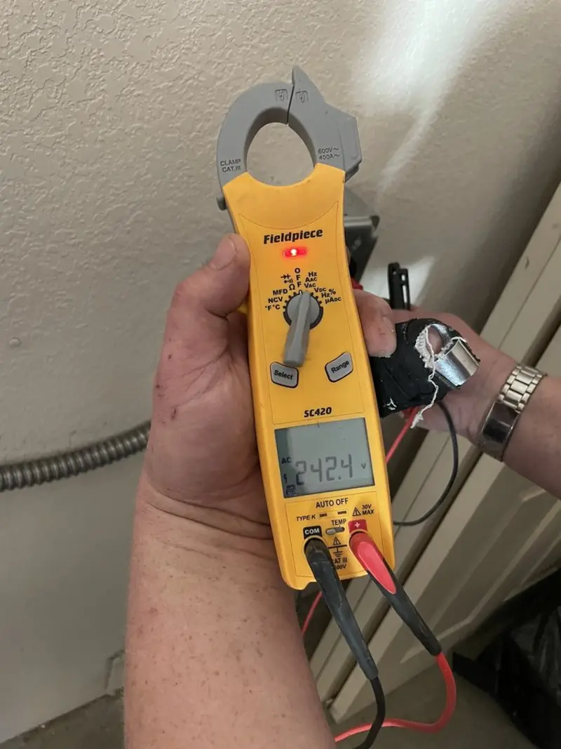 Voltage testing with clamp meter during Electrical Installation Services in Savannah